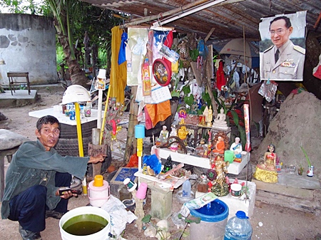 Sangworn Liemgpheng works to restore broken religious figurines.